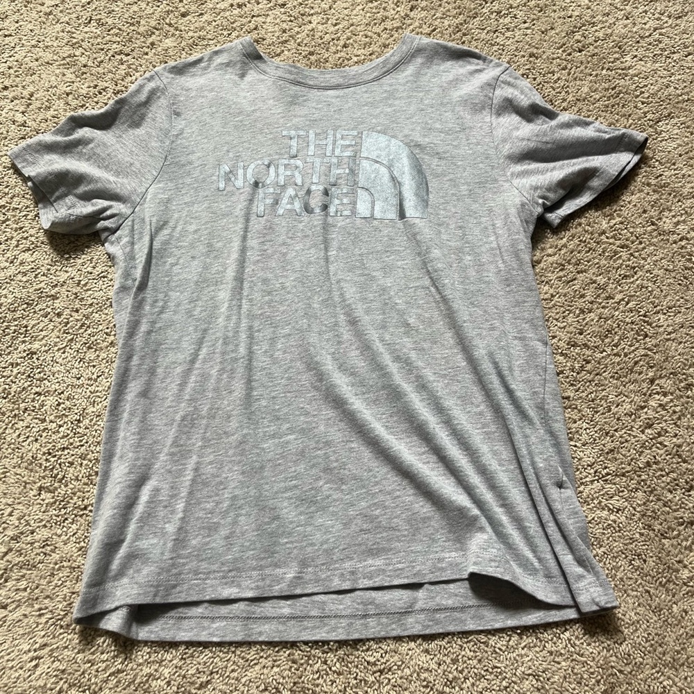 The North Face T-shirt. Gray with silver wording. Great condition!